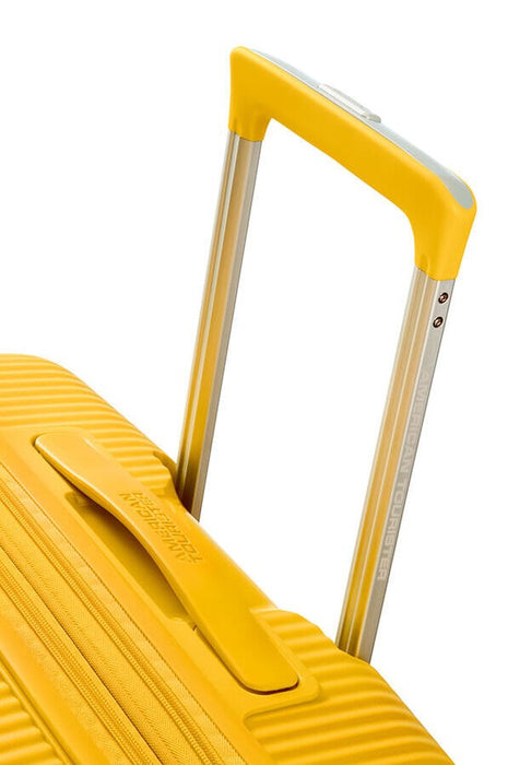 Голям куфар American Tourister Soundbox - златисто жълт